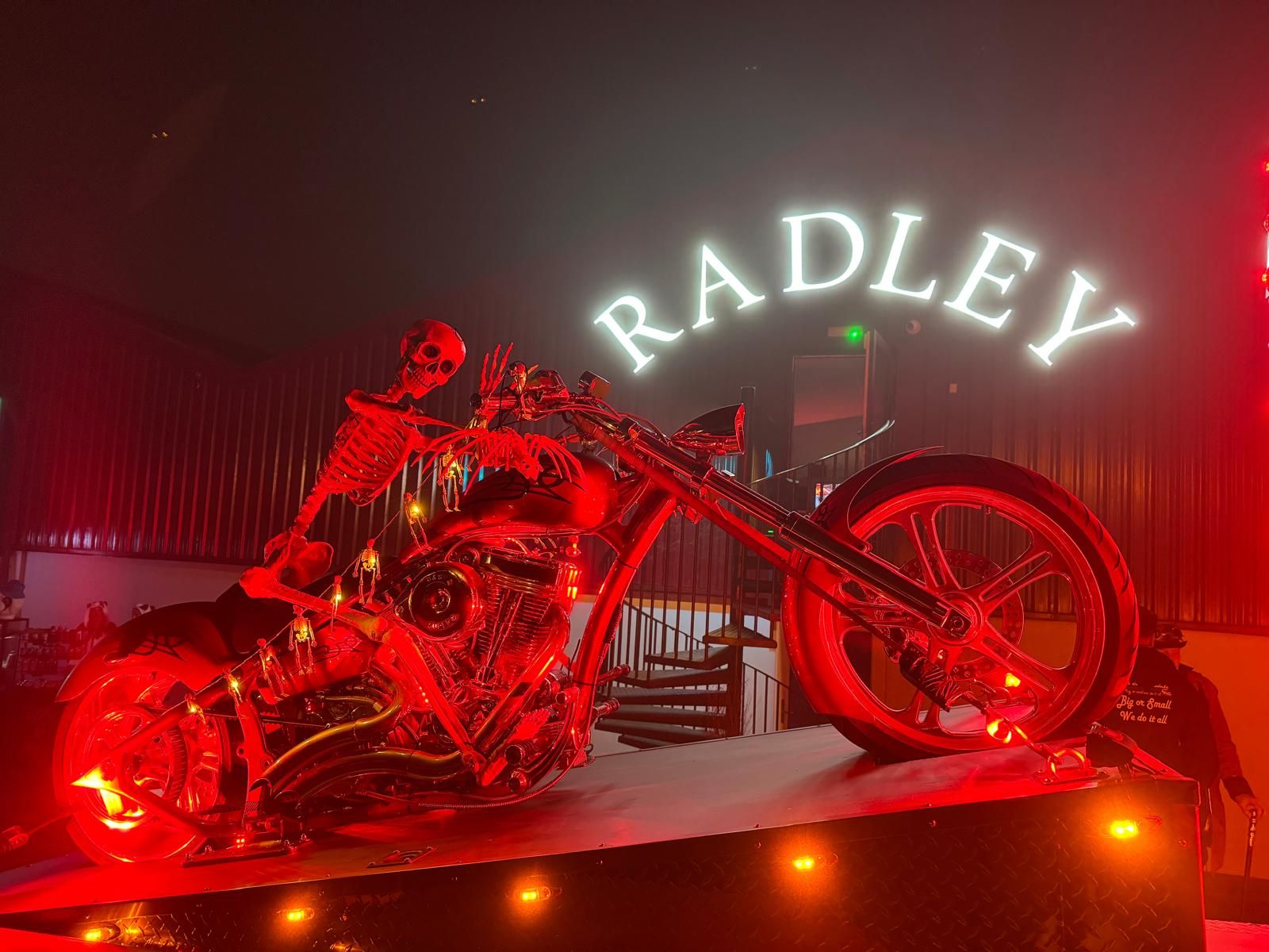Radley community event at night with a lit RADLEY showroom sign