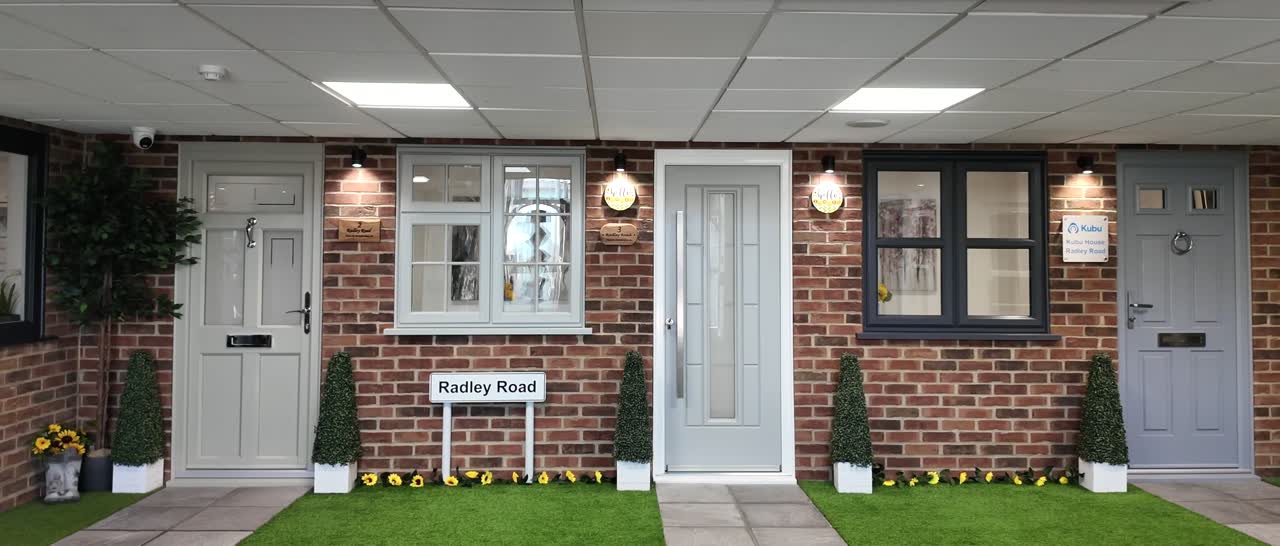 Full-size front doors and windows on the Radley Road display street inside the Radley showroom in Aylesbury