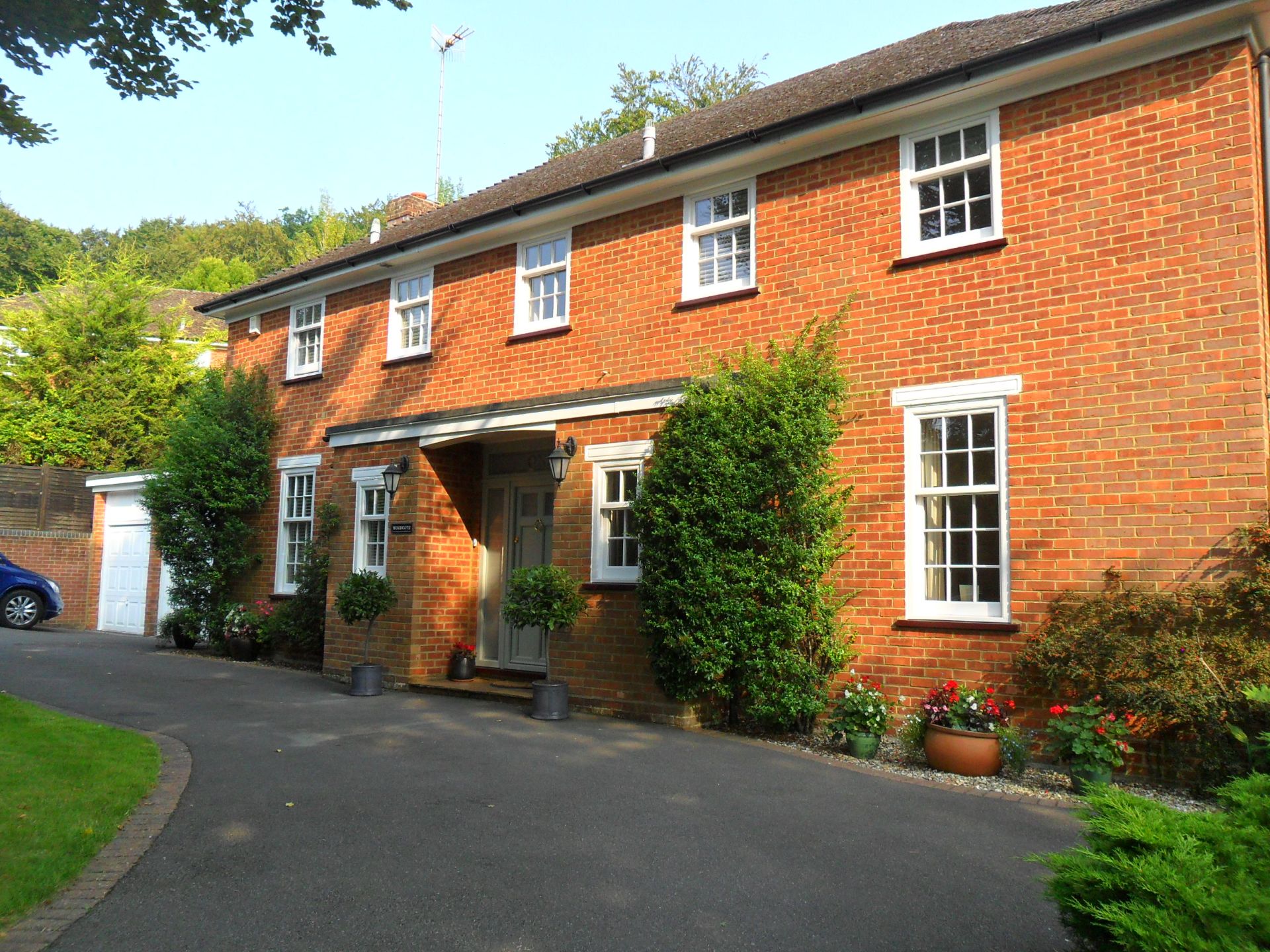 White uPVC sash windows in a red-brick Buckinghamshire house