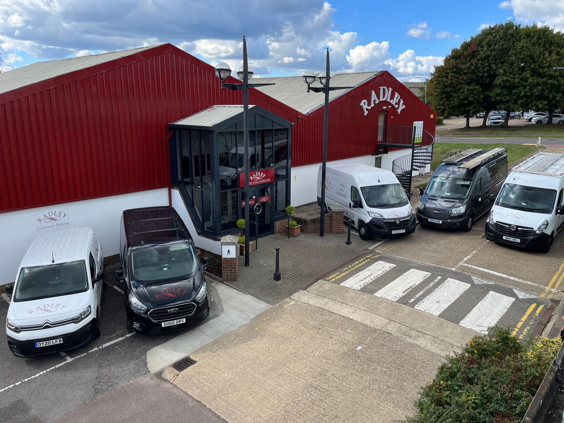 Radley showroom with branded company vans parked outside